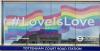 #LoveIsLove on billboard outside Tottenham Court Road